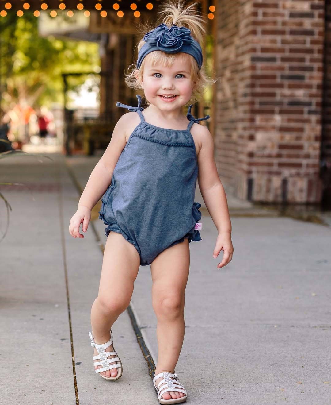 RuffleButts + RuggedButts - Baby Girls Faux Denim Pom Pom Bubble Romper