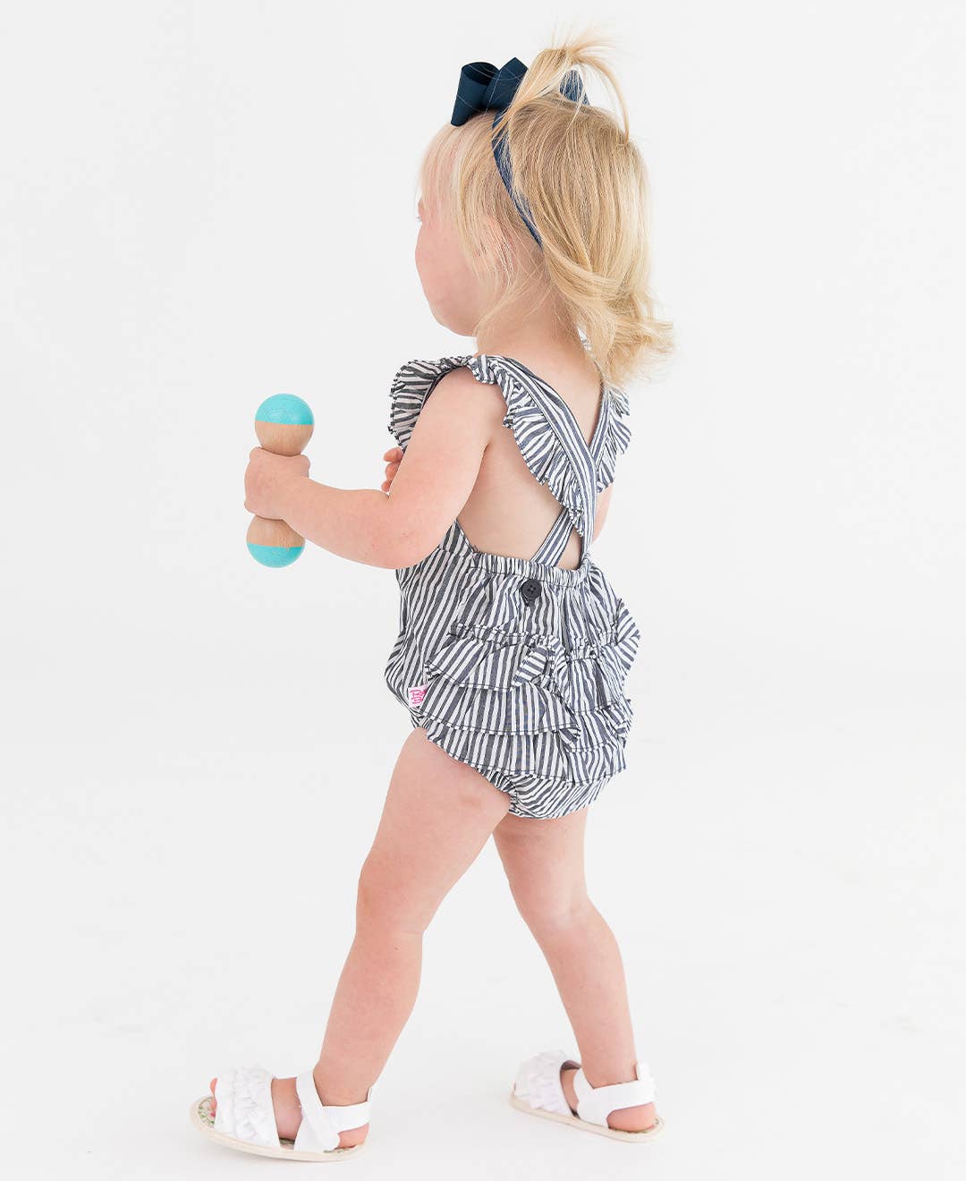 RuffleButts + RuggedButts - Baby Girls Navy Micro Stripe Woven Pinafore Cross-Back Bubble Romper