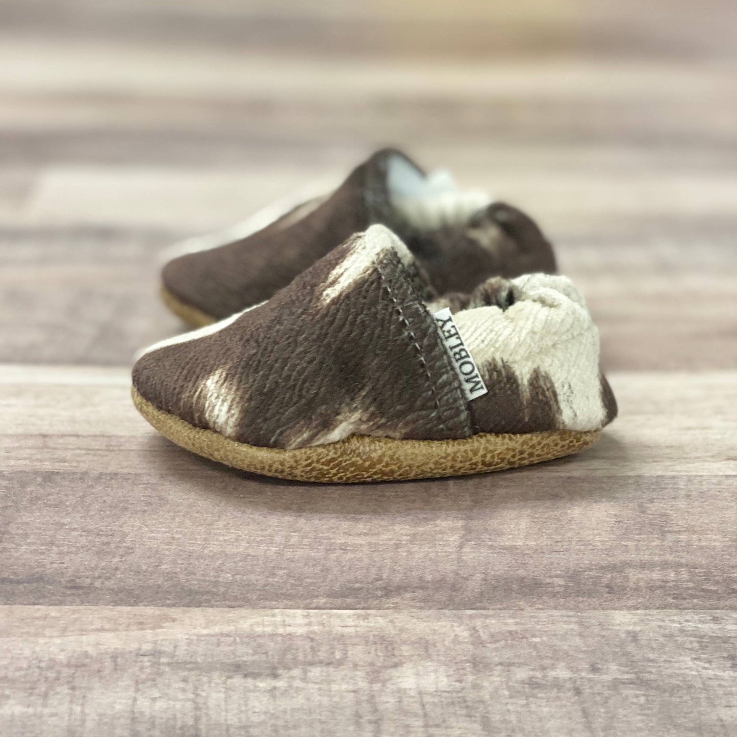 Trendy Baby Mocc Shop - Faux Cow Hide Moccasins