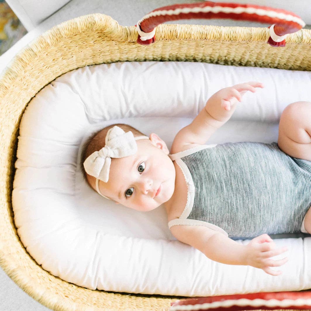 ***Available in-store only!!***Plum & Sparrow - Natural- African Moses Basket - Cognac + Cream Handle/ Mattress, Liner and Pom Pom set included!